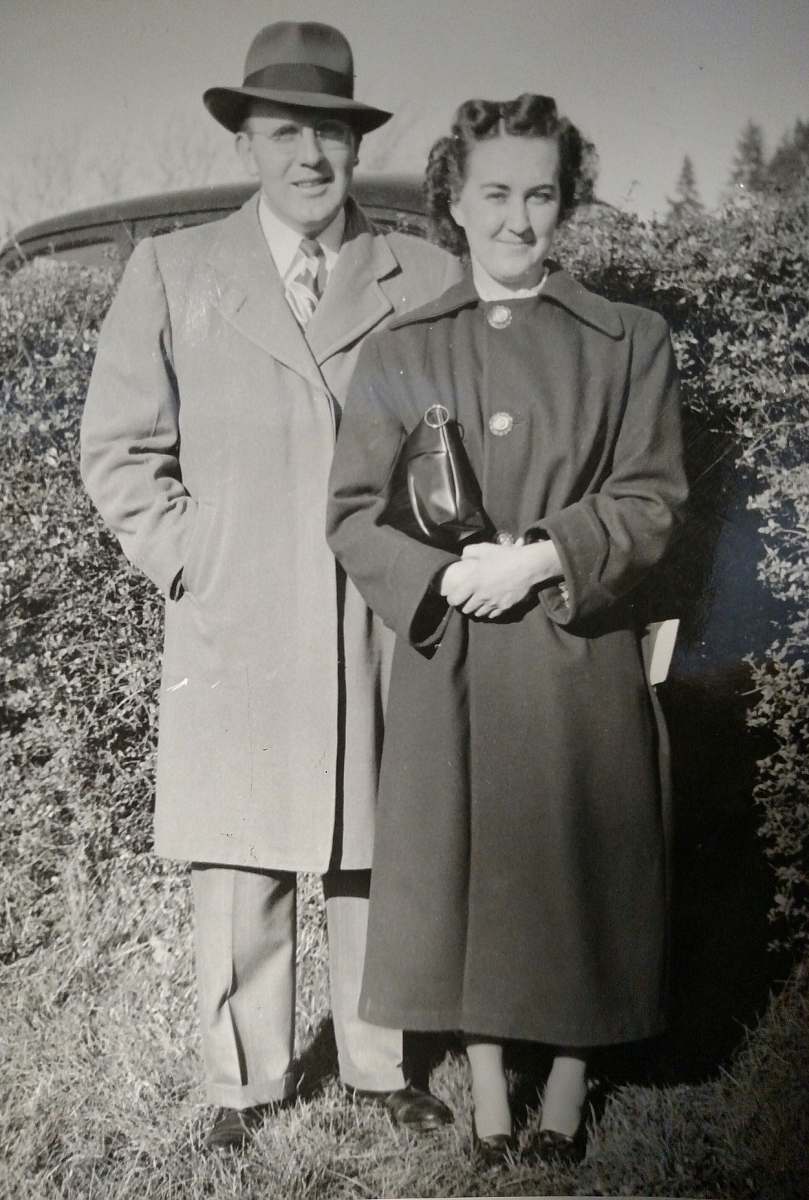 people grayscale photography of man and woman wearing coat person