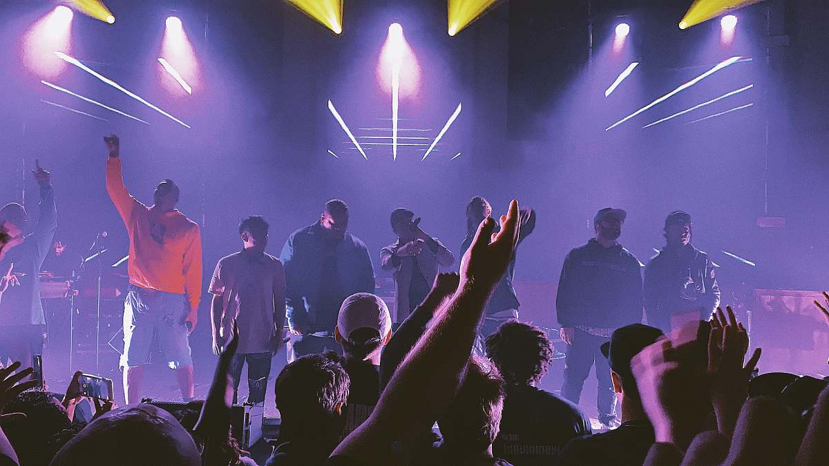 person group of people singing on the stage club