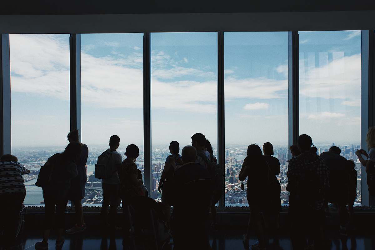 person group of people standing inside building new york
