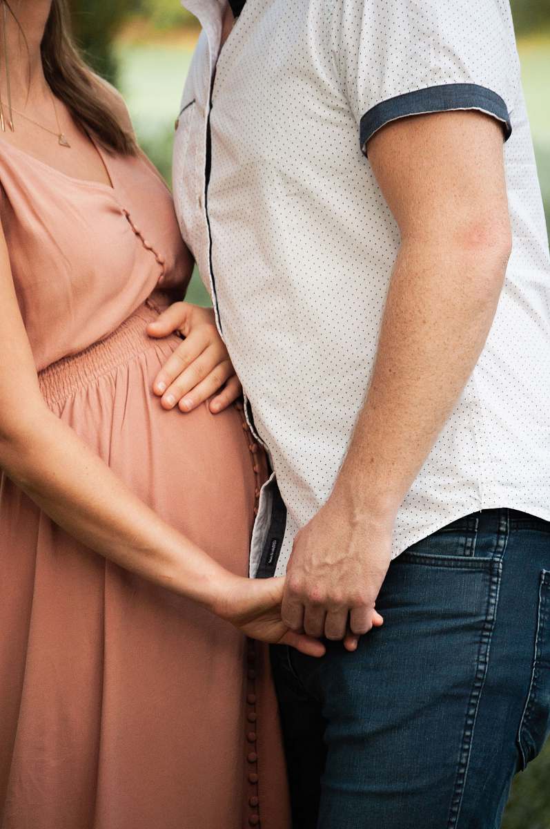 person man holding pregnant woman people