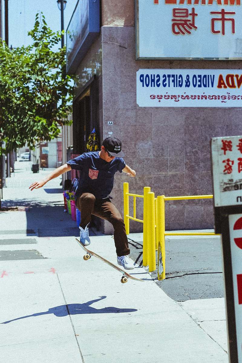 people man in blue shirt skateboarding on gray surface skateboard