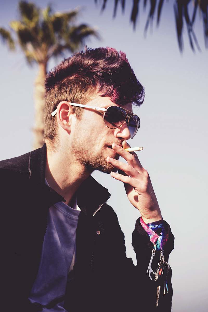 person man smoking at daytime people