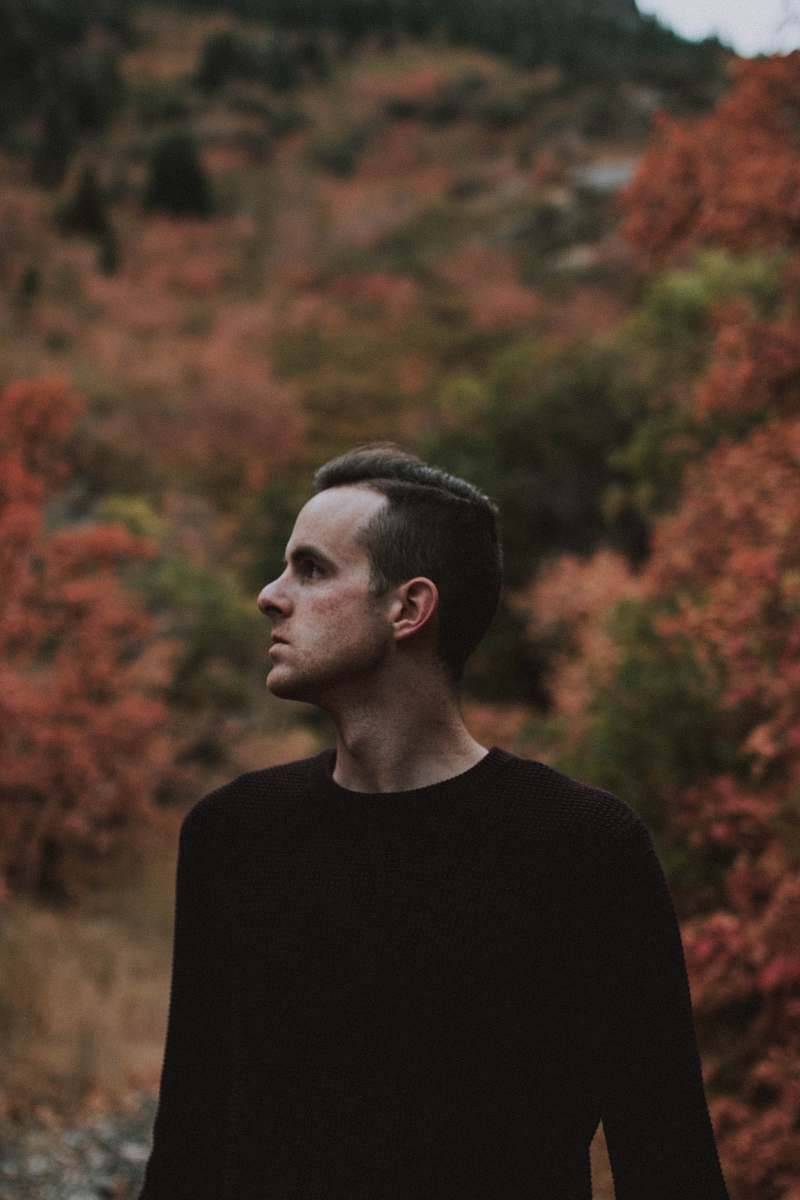 person man standing outdoor near trees during daytime people