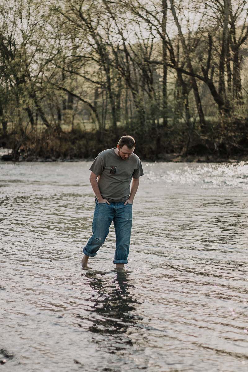 people man walking in the lake at daytime person