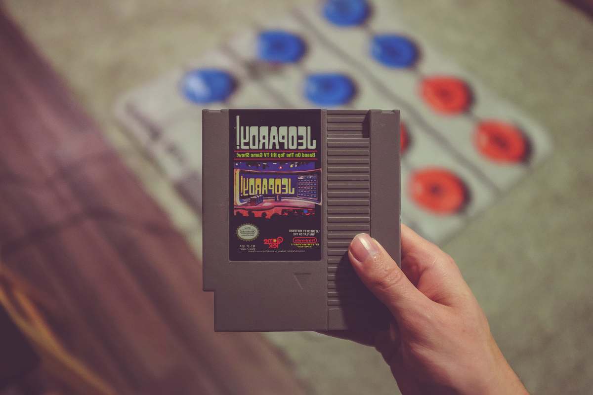 person Nintendo Jeopardy game cartridge advertisement