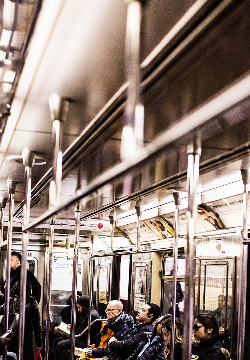 subway people sitting and standing inside train train