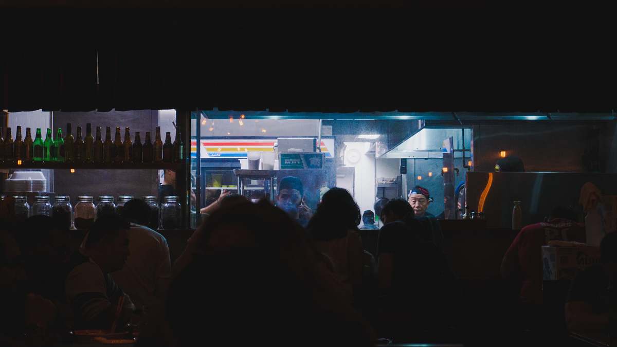 indoors people standing near blue lighted building during nighttime interior design