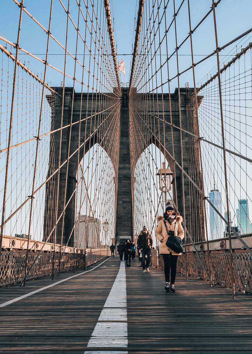 person people walking on bridge during daytime bridge