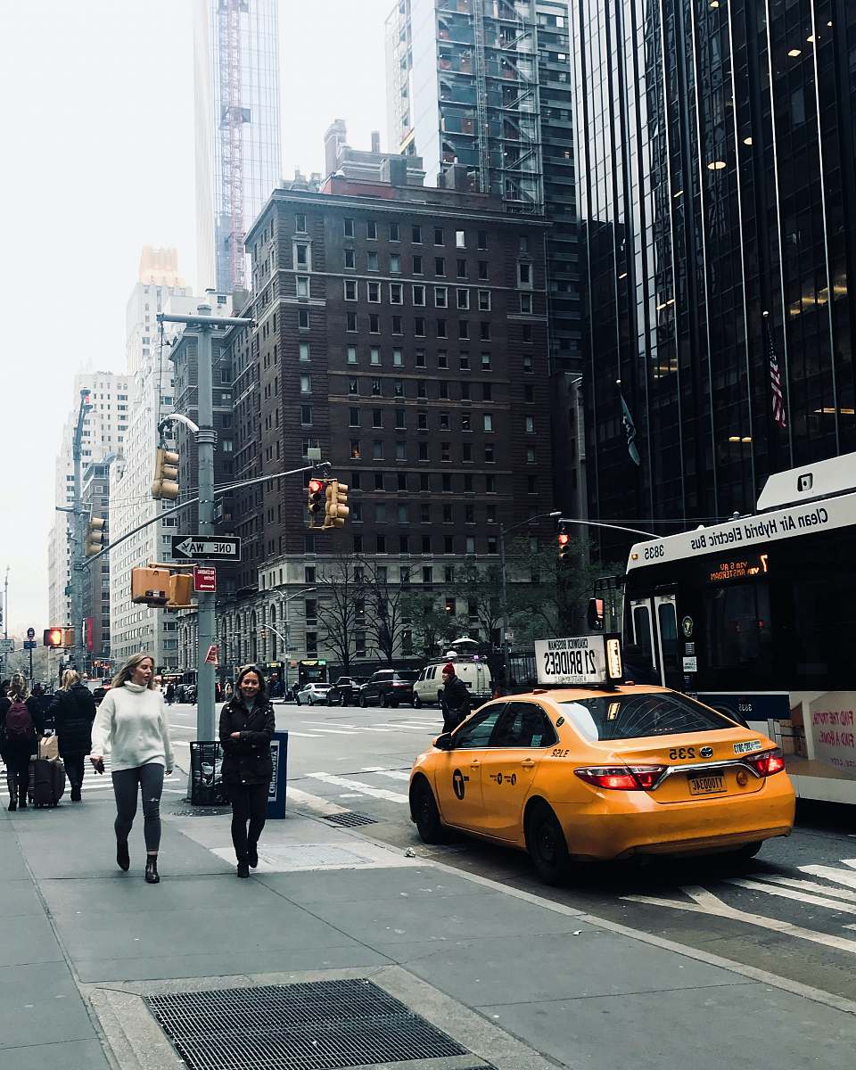 person people walking on pedestrian lane during daytime automobile