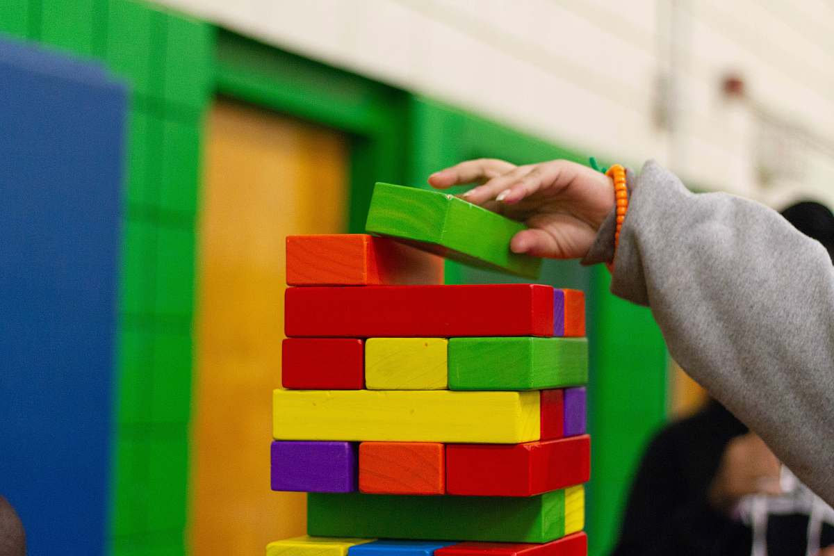 wood person piling blocks toy