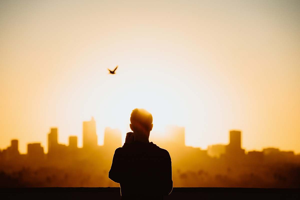 person silhouette photography of person during sunrise people