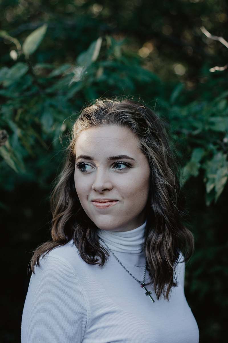 person smiling woman wearing white turtleneck top people