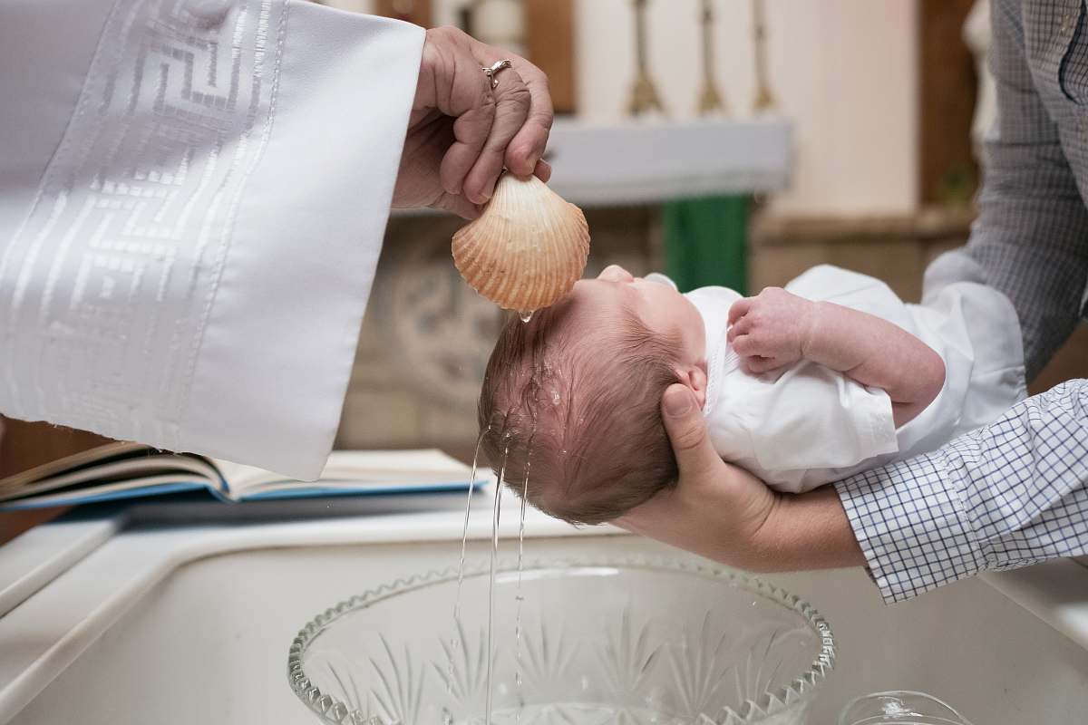 person toddler baptized baby