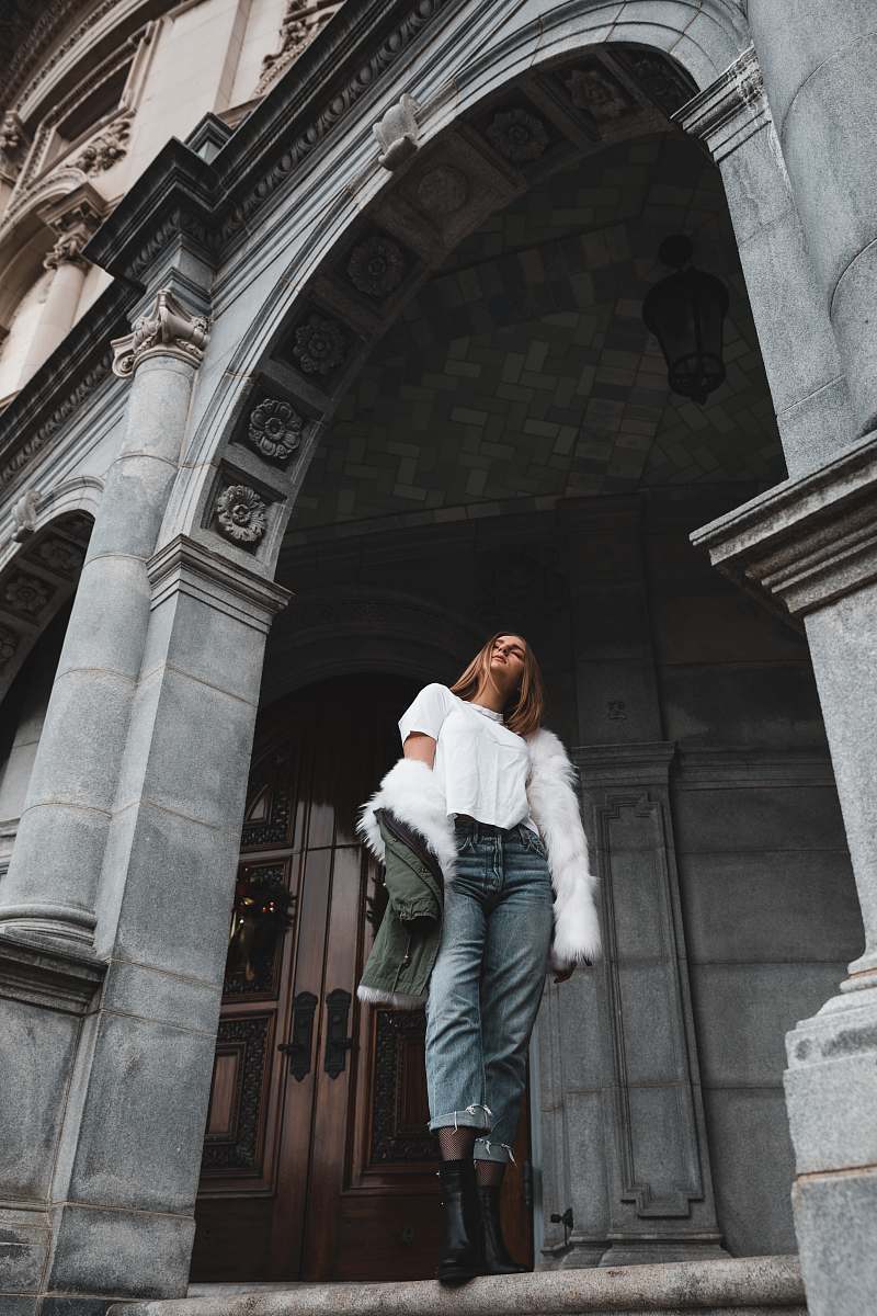 person woman in white coat standing people