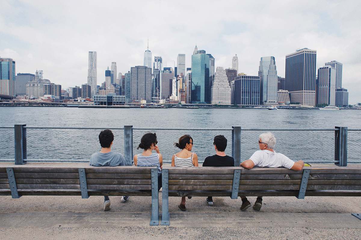 person woman sitting on the bench sitting