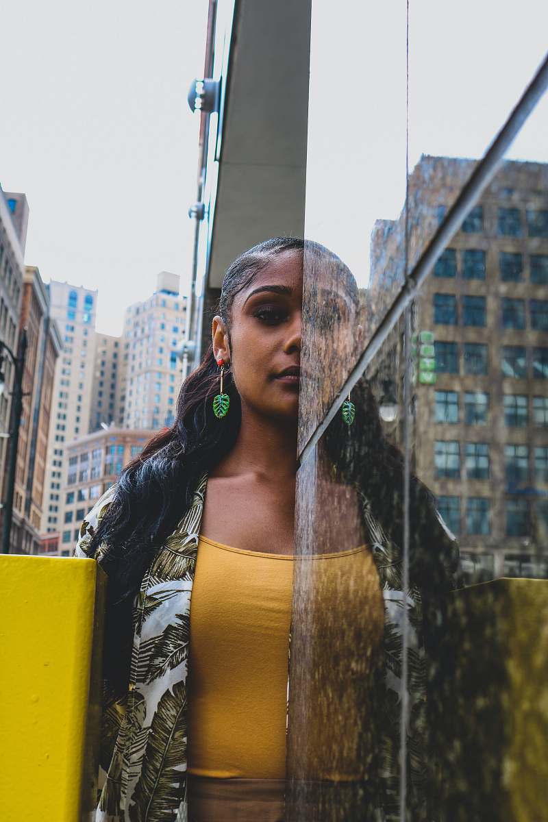 people woman standing in front of tile wall person