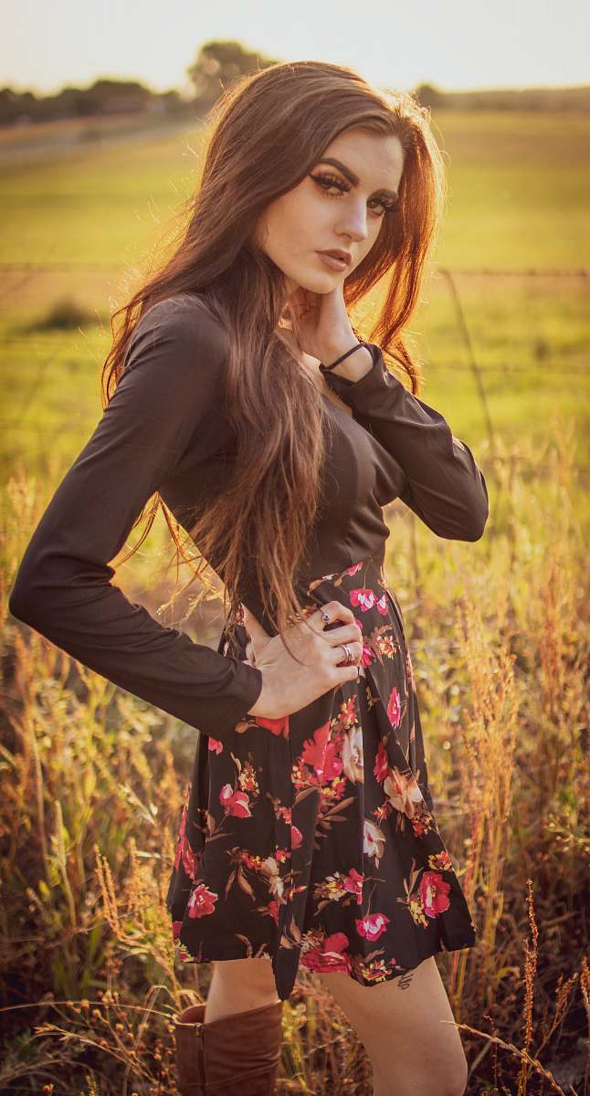 apparel woman standing on green grass field clothing