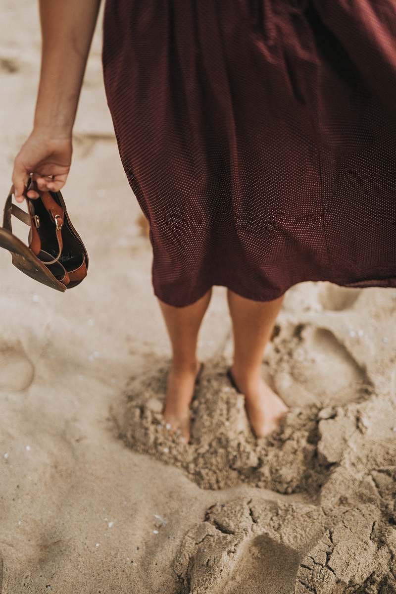 mud woman stepping on brown sand soil