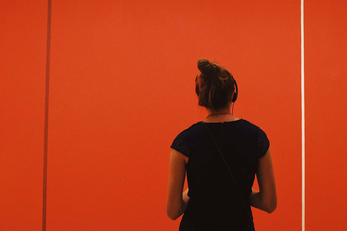 person woman wearing headphones apparel