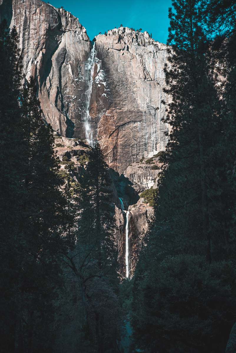 mountain waterfalls on rock mountain cliff