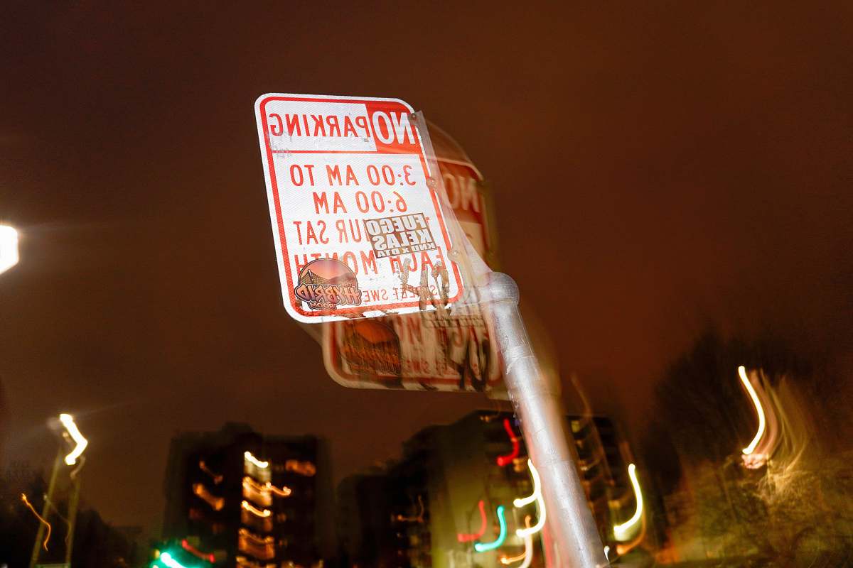 text white and red street sign advertisement