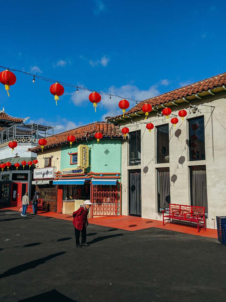 lamp woman walking during daytime chinatown
