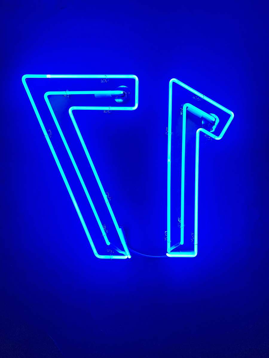neon blue letter y on blue background blue
