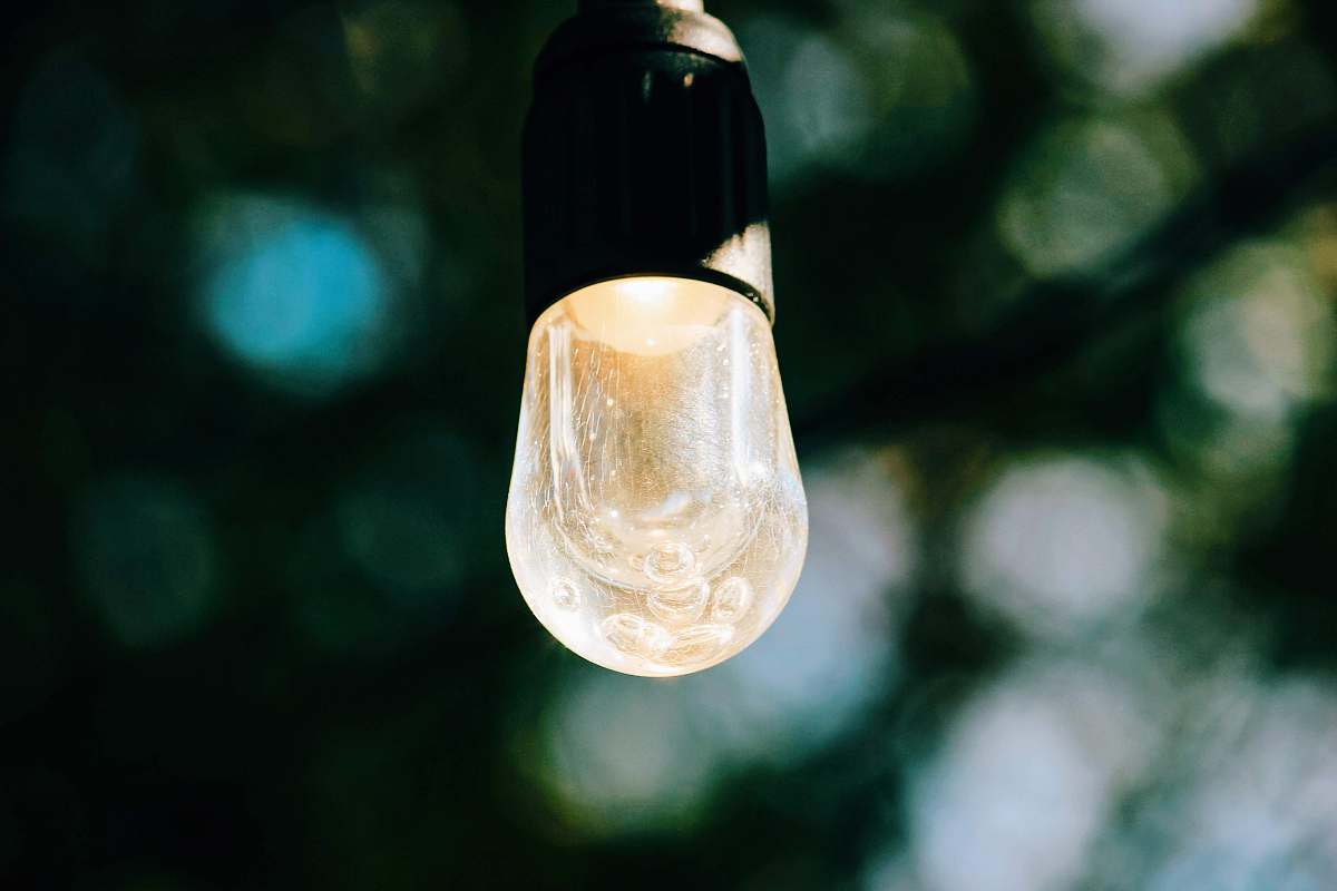 lightbulb clear glass light bulb turned on in tilt shift lens rosemary beach
