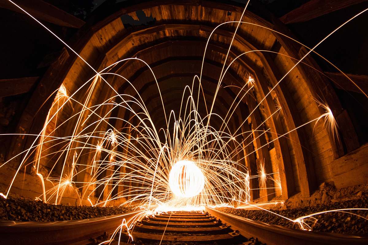 night steel wool photography between concrete wall ironwood