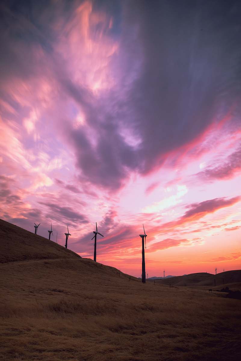 engine wind mills on hill under cloudy sky motor