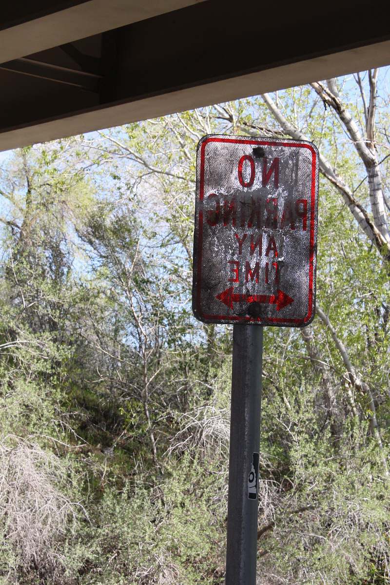 postbox no parking any time signage near green trees at daytime big cottonwood canyon