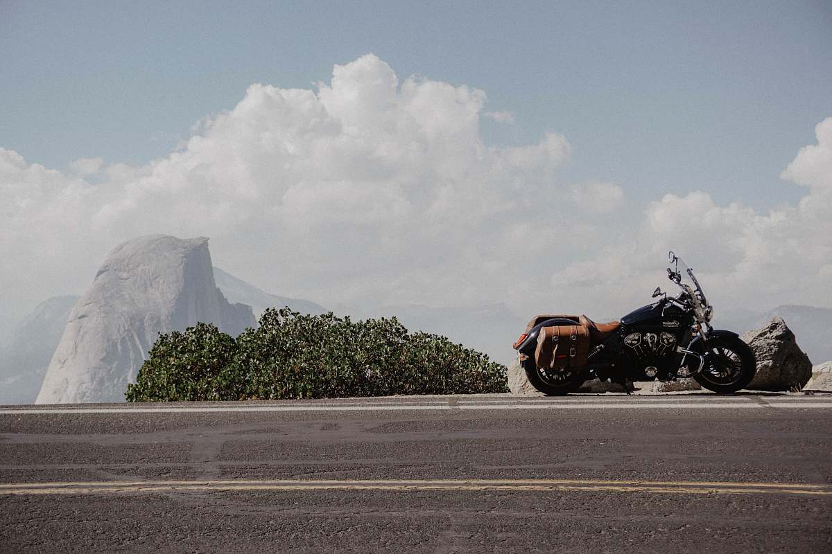 transportation black cruiser motorcyle beside a black road vehicle