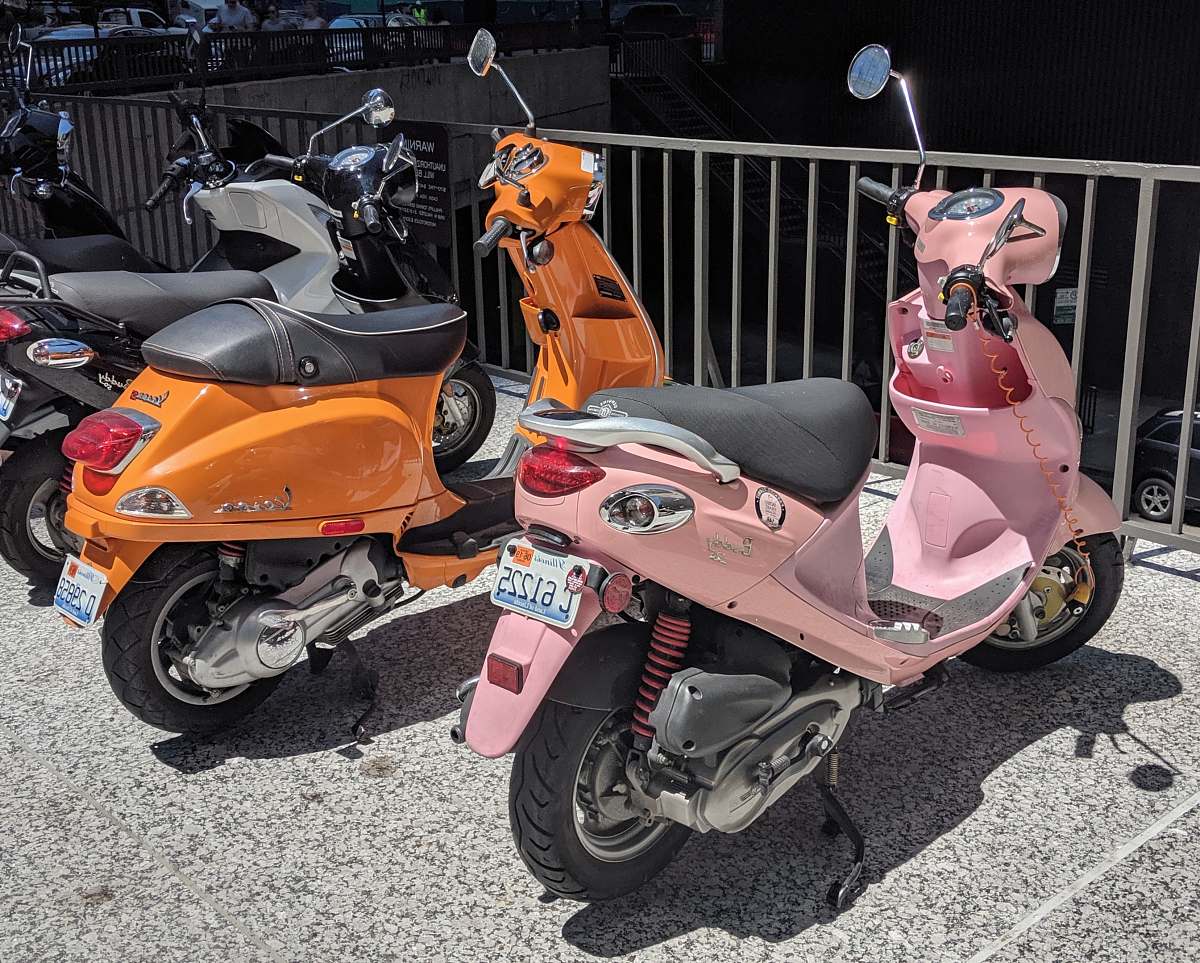 transportation parked pink motor scooter vehicle