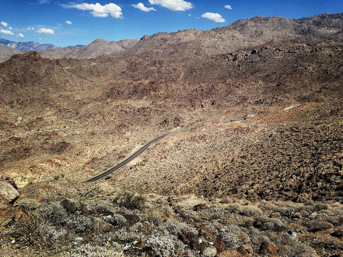 road aerial photography of winding road on brown mountain ca-74