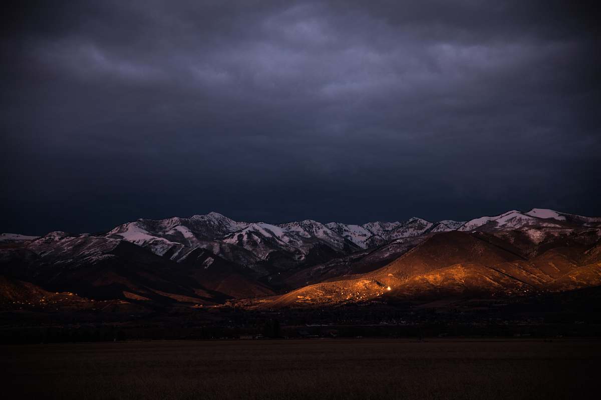 cloud brown mountain under gray clouds during golden hour sky