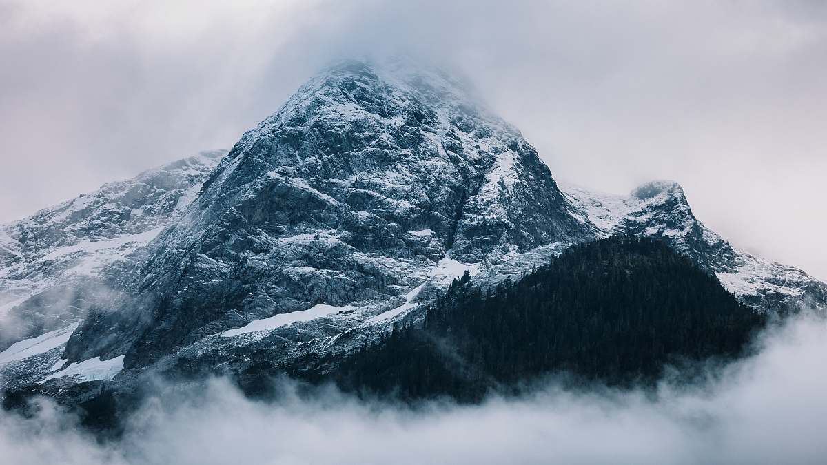nature gray mountain covered in snow at daytime peak
