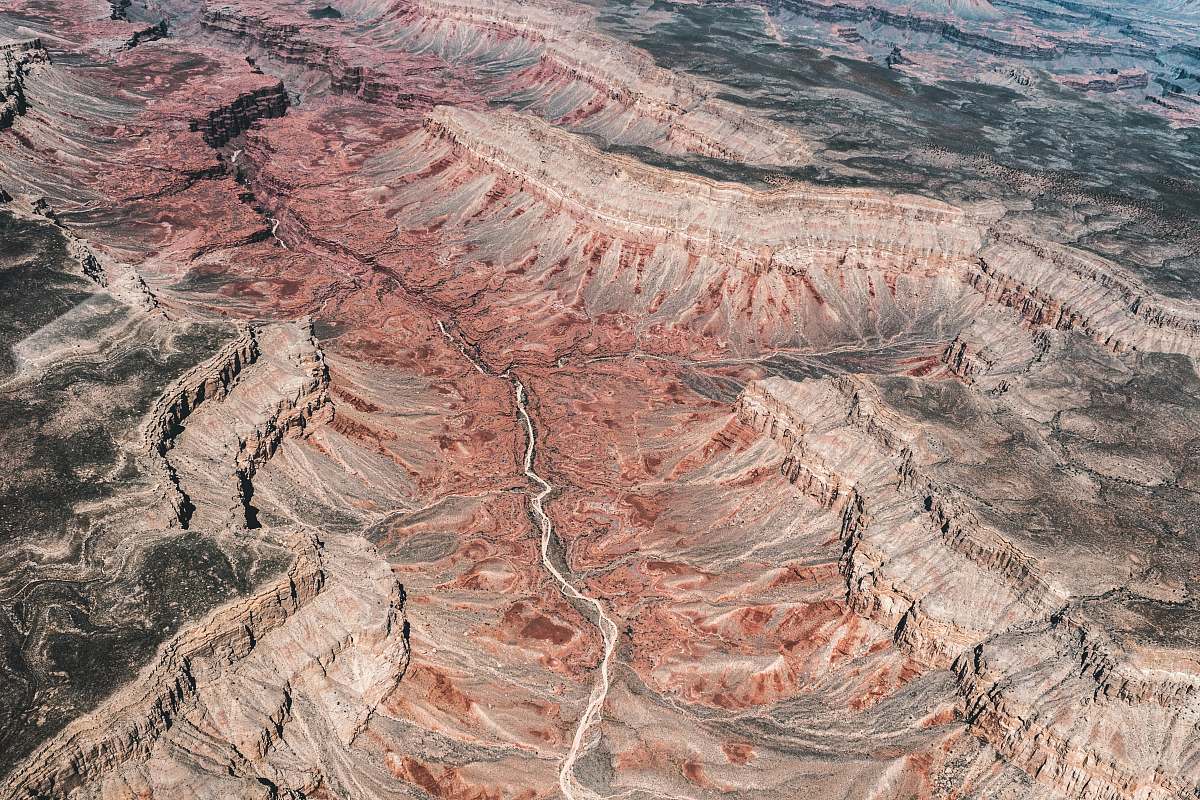 canyon aerial photography of brown rock mountain valley