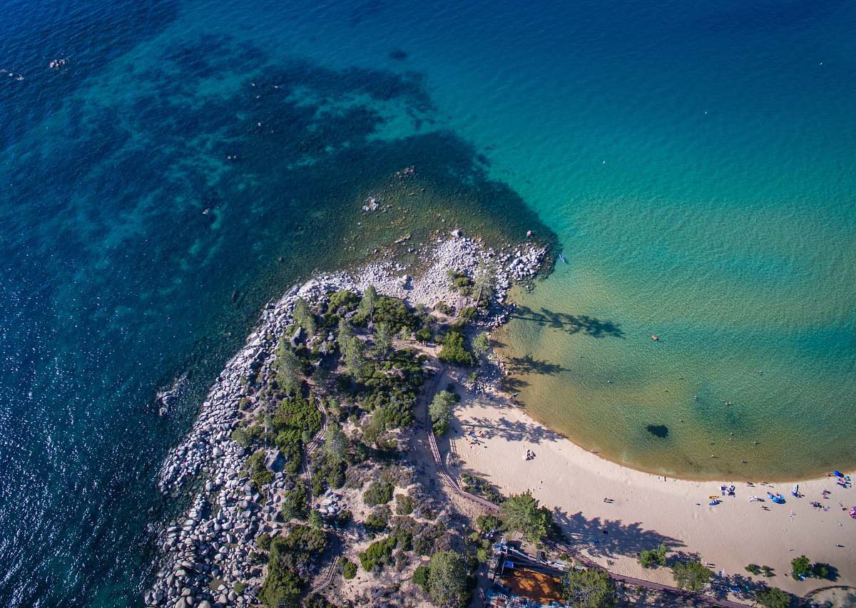 outdoors aerial view of green trees and body of water during daytime landscape
