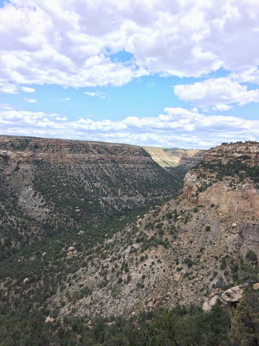 outdoors brown and green mountain under blue sky during daytime plateau