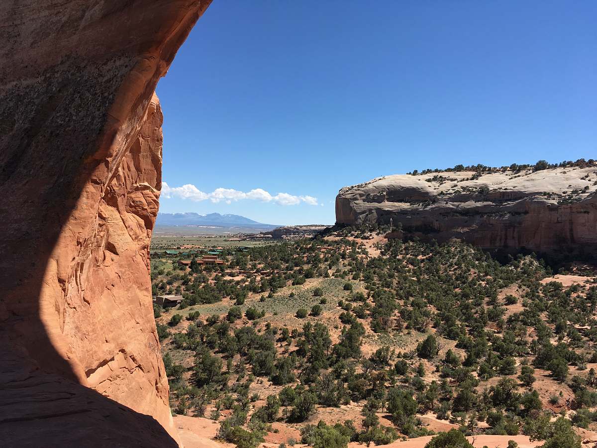 outdoors brown rock formation under blue sky during daytime mesa