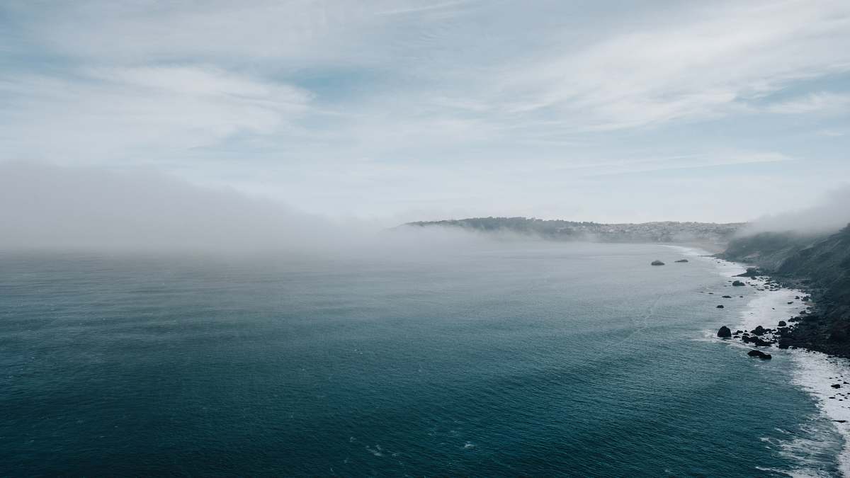 outdoors calm body of water during daytime sea