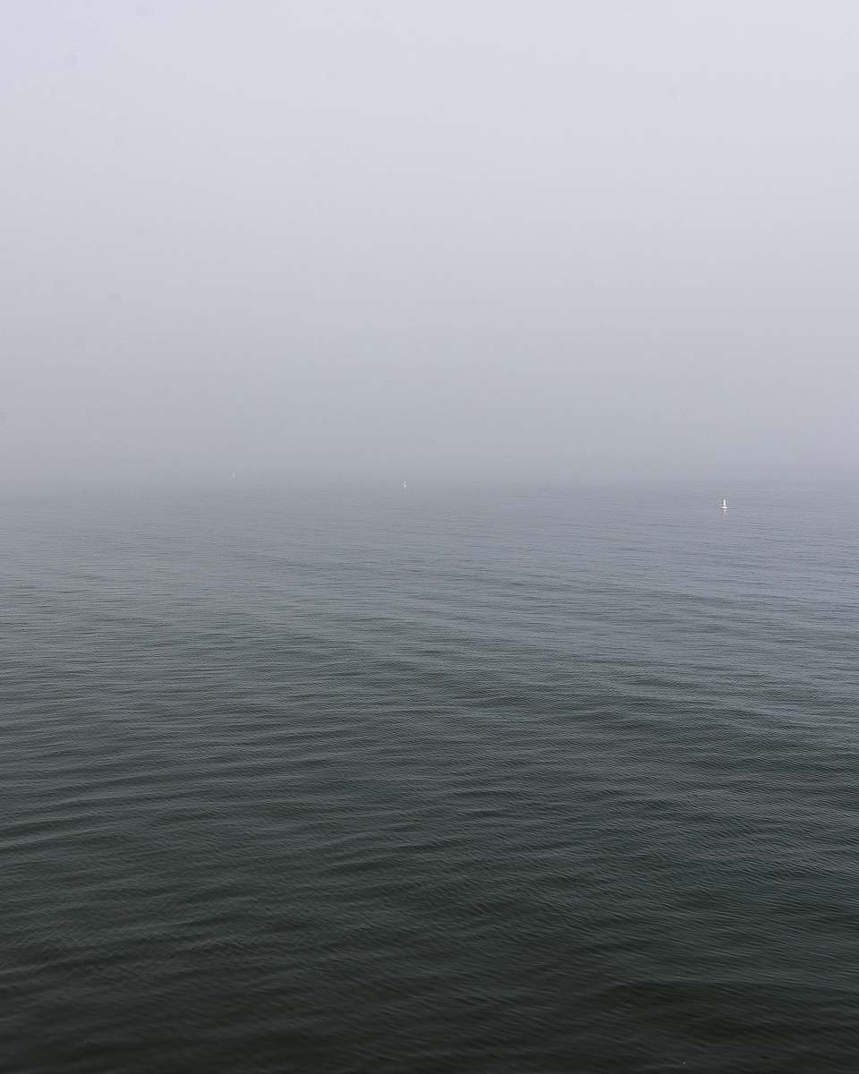 grey calm body of water weather