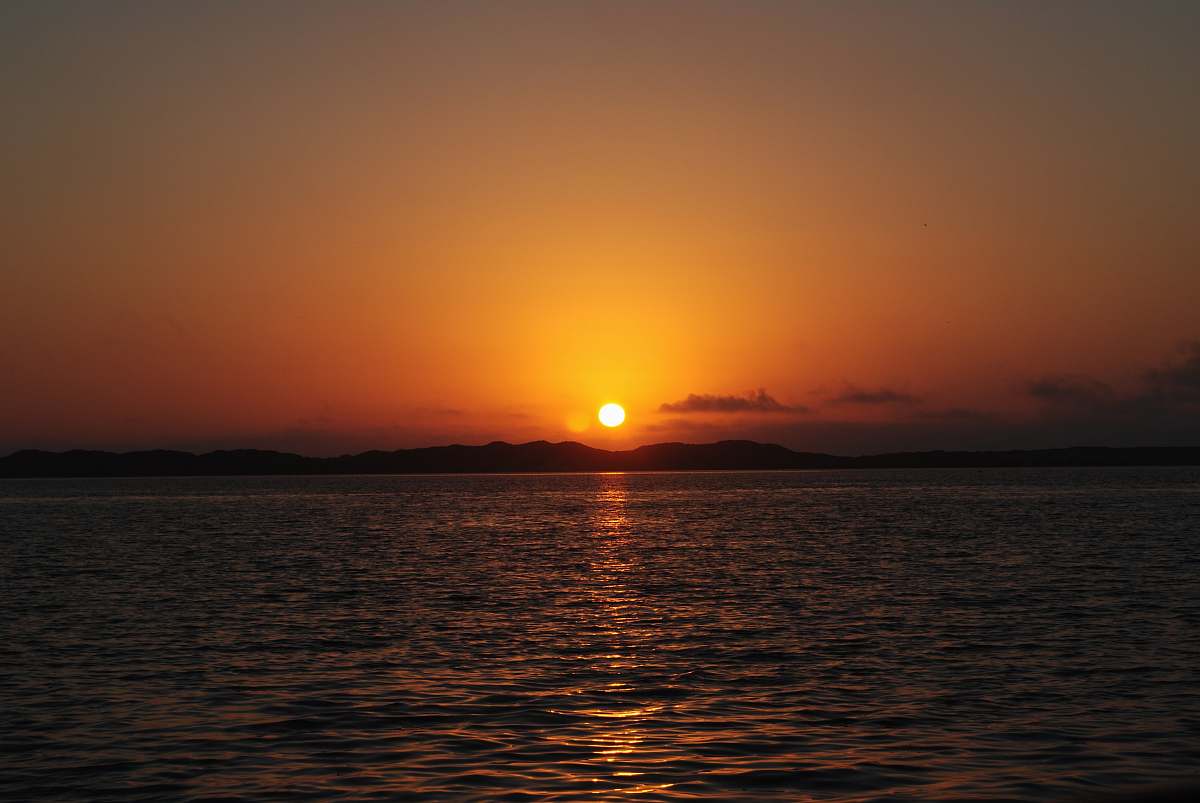 outdoors calm sea during sunset sunlight