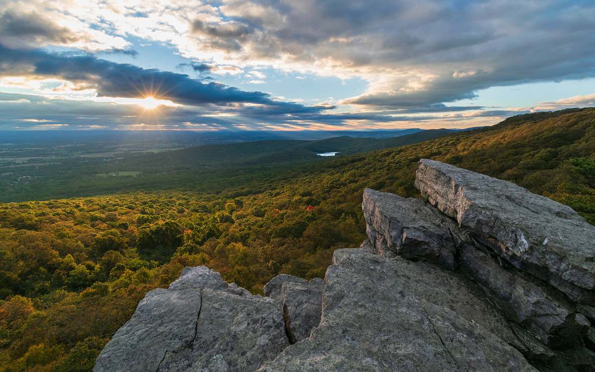outdoors gray cliff near trees flare