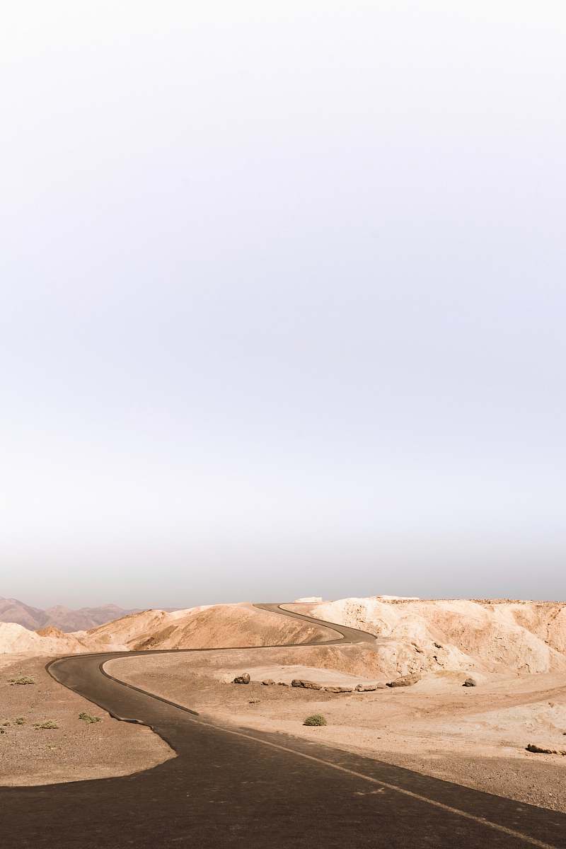desert grey asphalt road on desert during daytime death valley