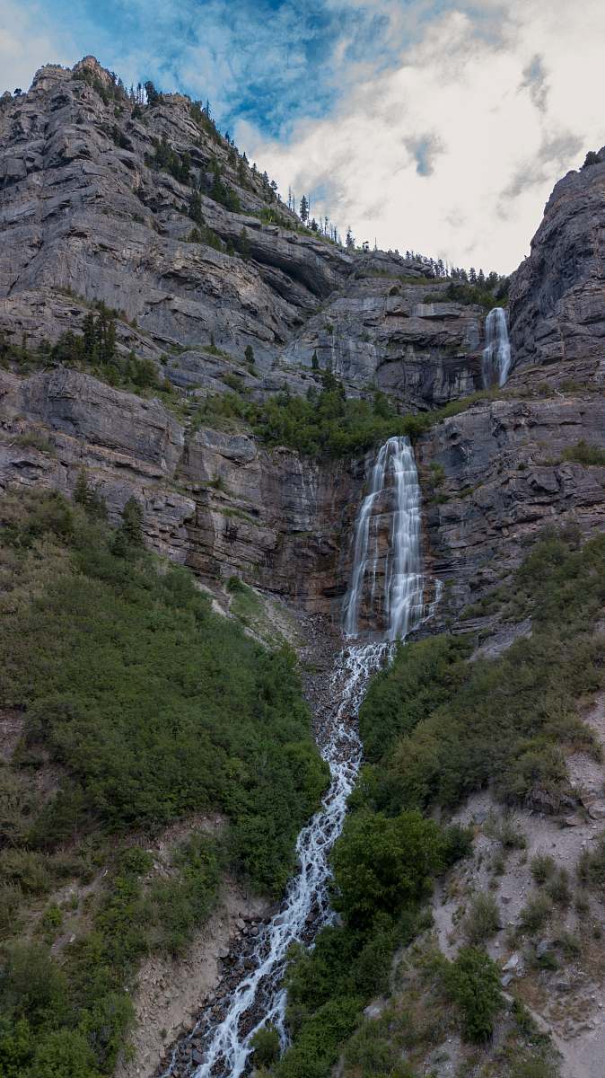 outdoors landscape photo of mountains and waterfalls river
