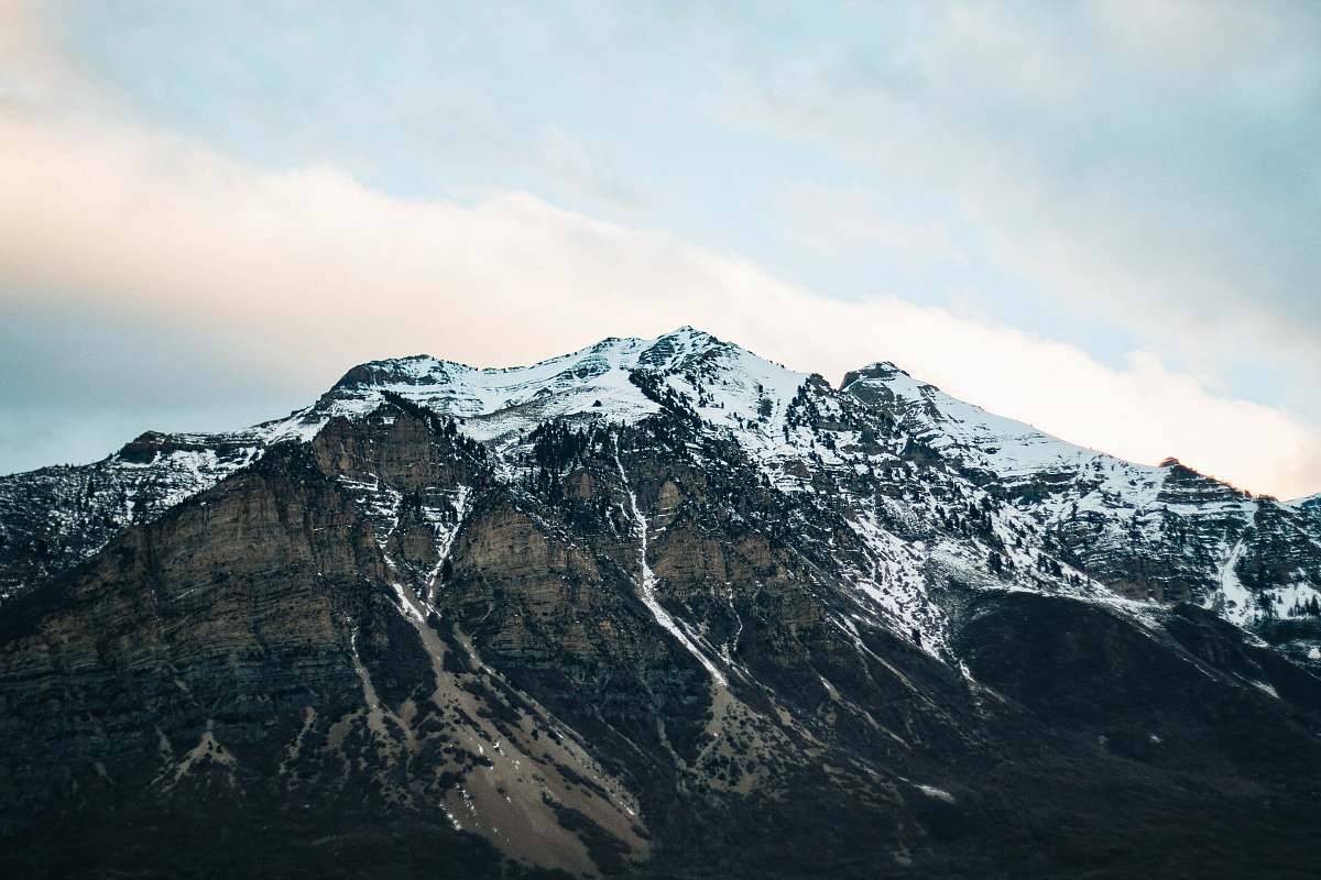 outdoors landscape photography of mountain covered with snow under the clear sky mountain