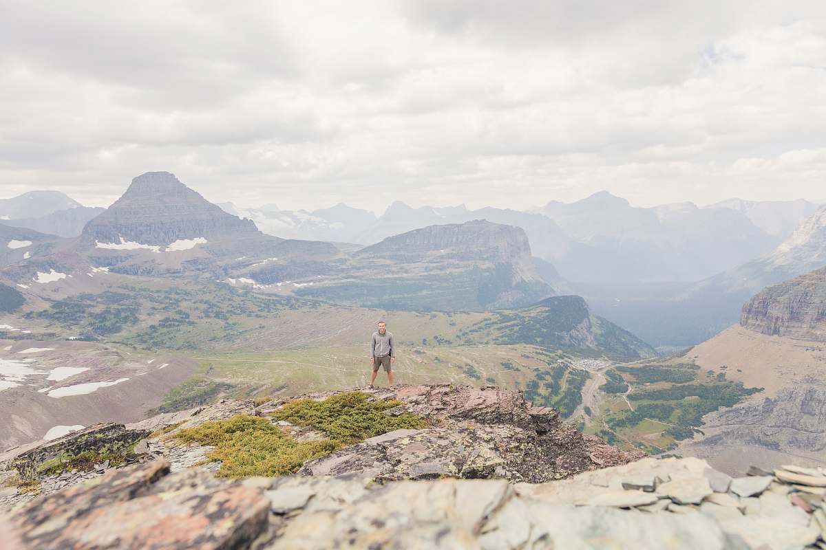 outdoors man standing on top of hill mountain