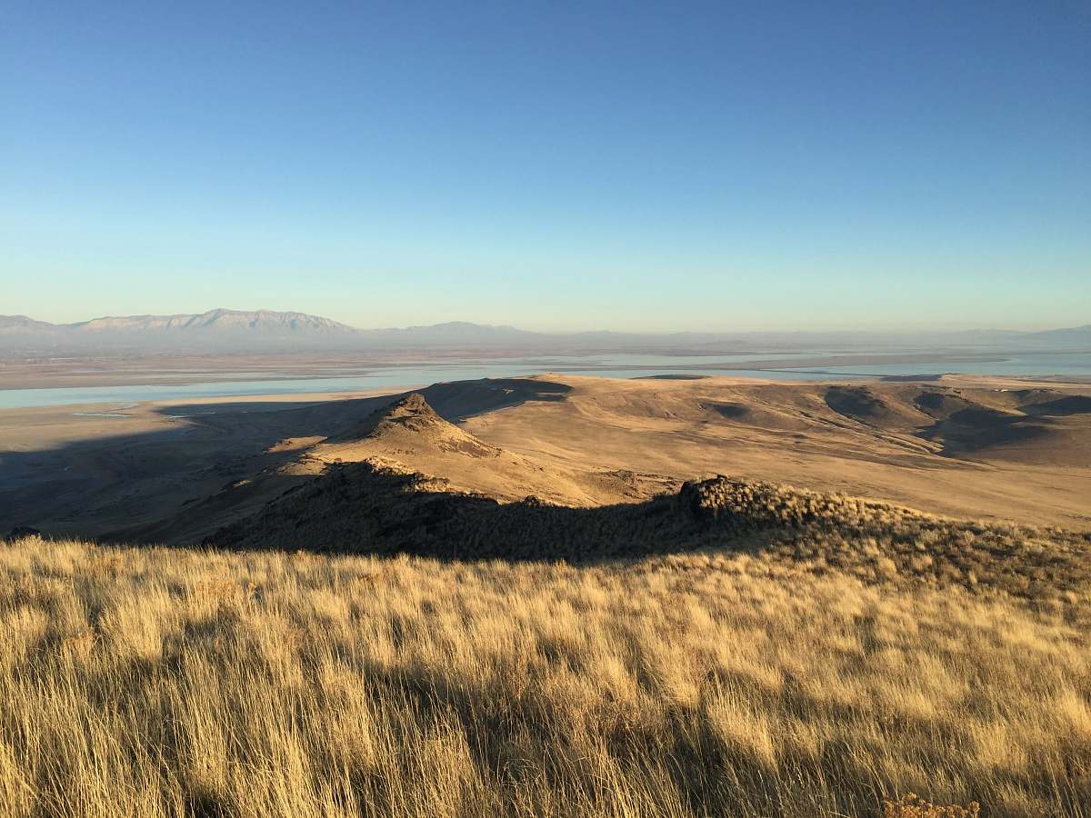 outdoors mountain and grassland under blue sky soil
