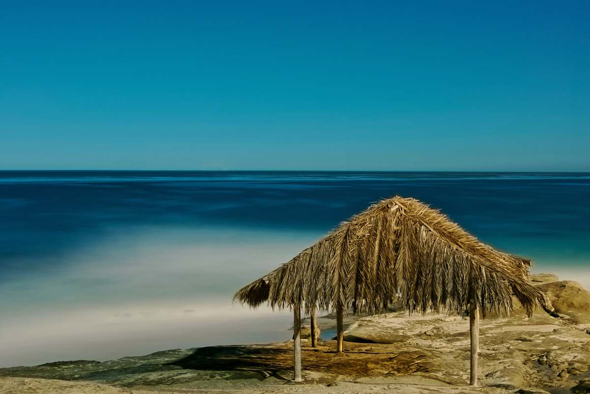 shoreline open cottage at the beach water